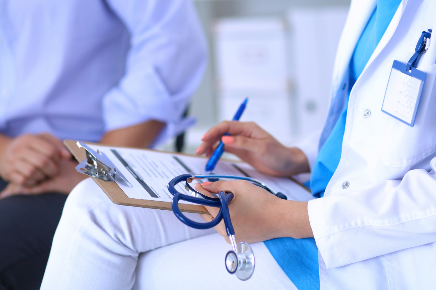 doctor with stethoscope and medical chart