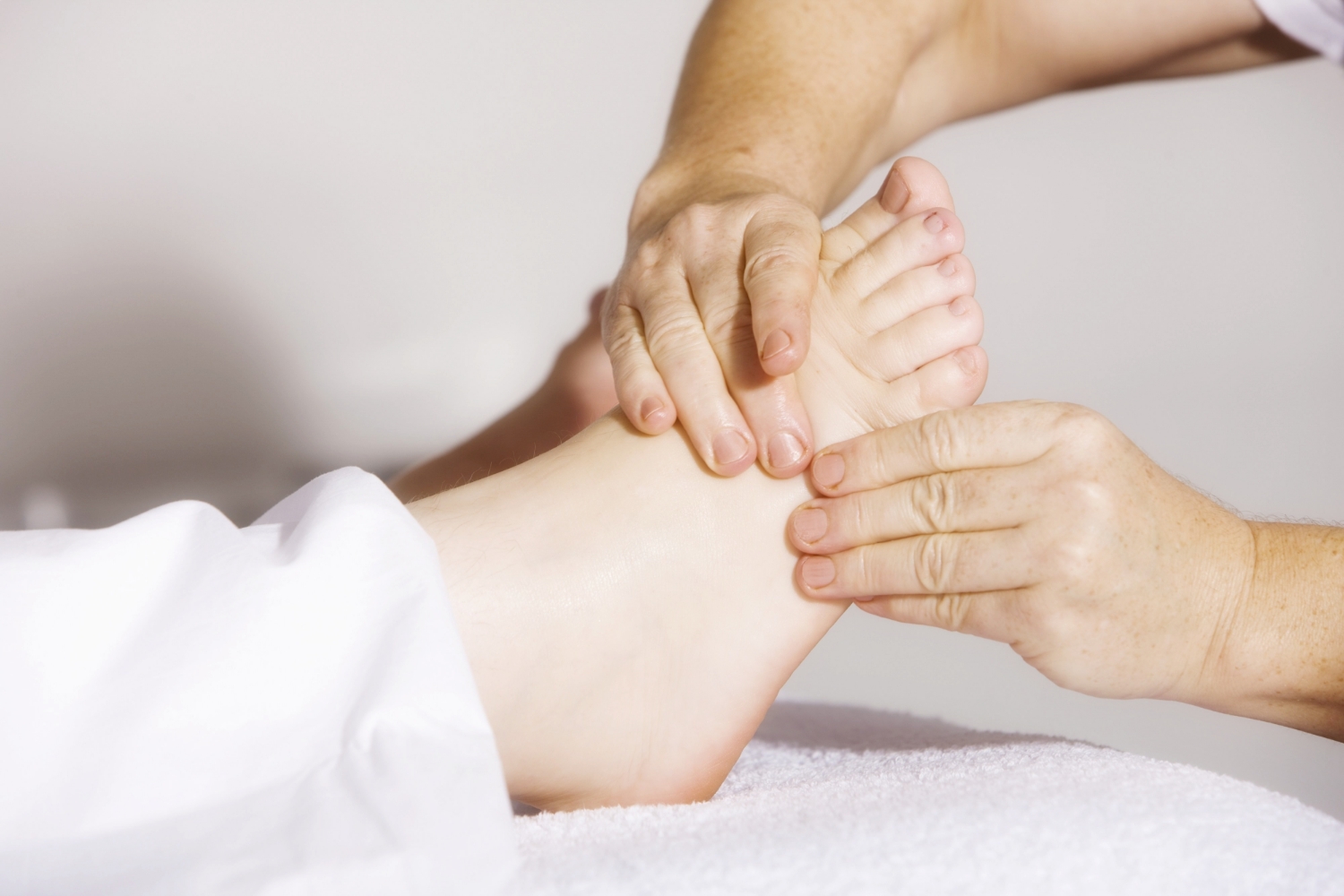 patient foot with physician massaging it